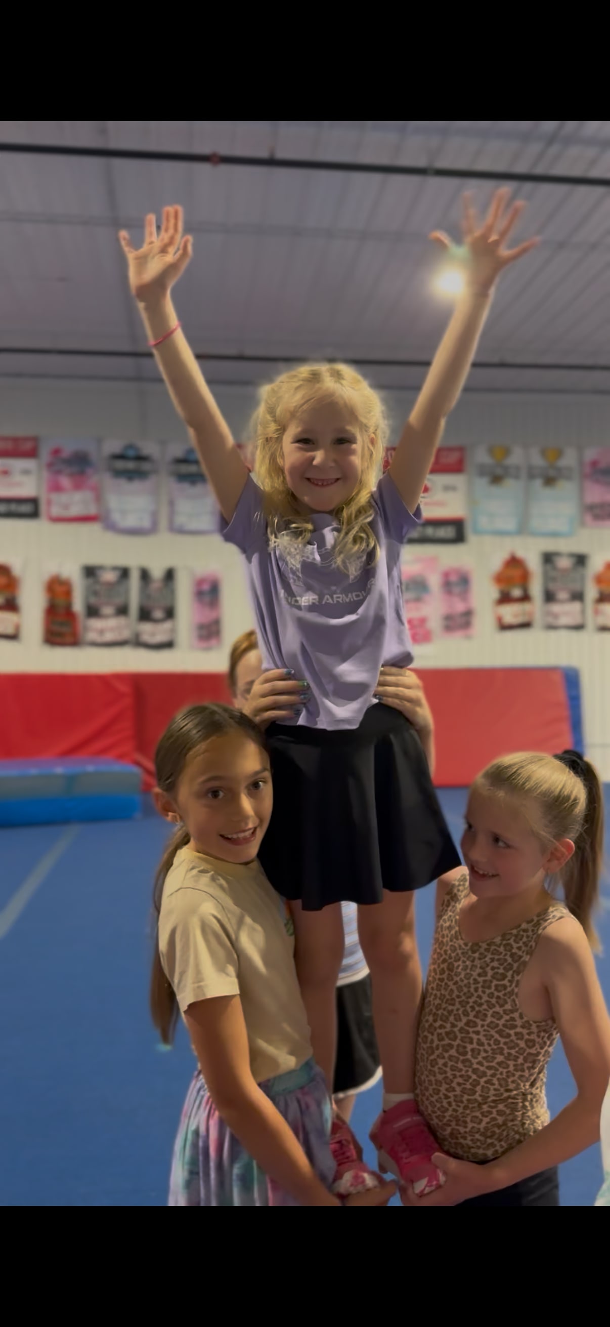 FUNdamentals athlete cheering with arms raised